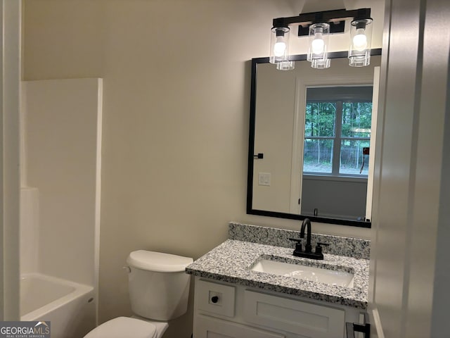 full bath featuring toilet, walk in shower, a tub to relax in, and vanity