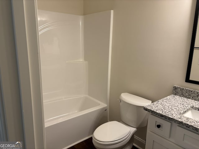 full bath featuring vanity, shower / bathtub combination, and toilet