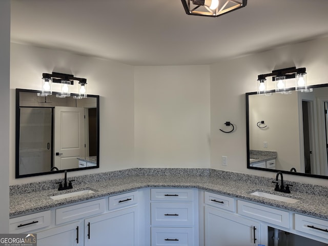 full bath with vanity and a shower with door