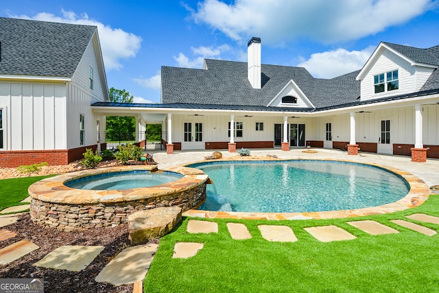 view of swimming pool featuring a patio, an in ground hot tub, ceiling fan, and french doors