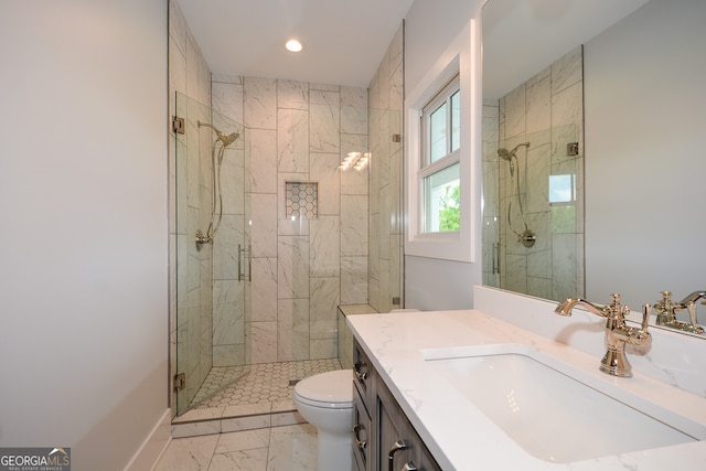 bathroom featuring a shower with shower door, tile flooring, vanity, and toilet