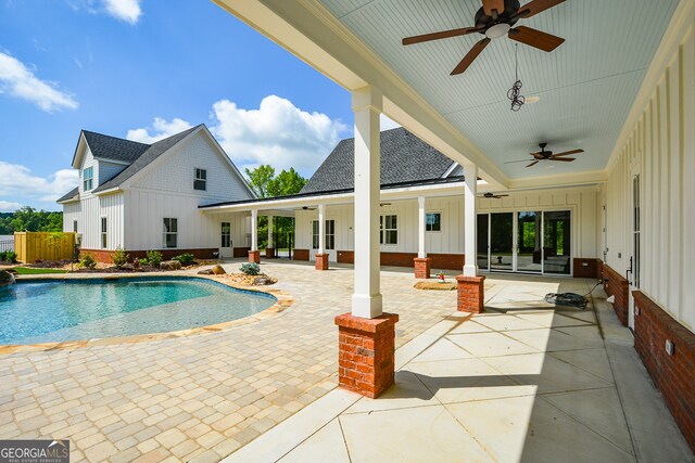 view of swimming pool with a patio and ceiling fan