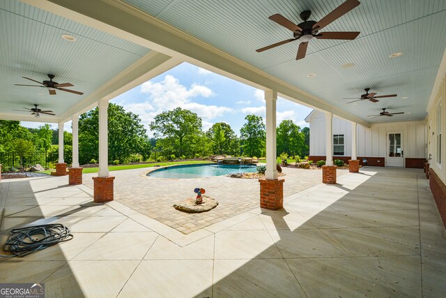 view of pool featuring a patio and ceiling fan