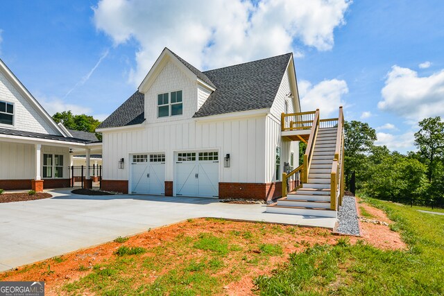 view of side of property with a garage