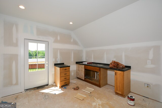 interior space featuring vaulted ceiling