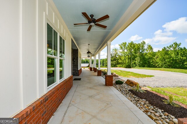 view of terrace featuring ceiling fan and a porch