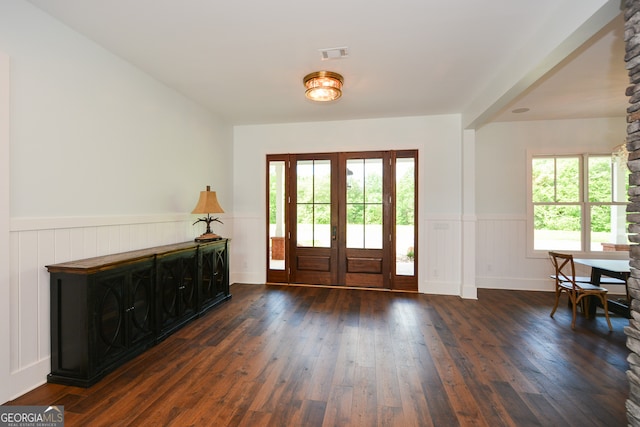 entryway with dark hardwood / wood-style flooring