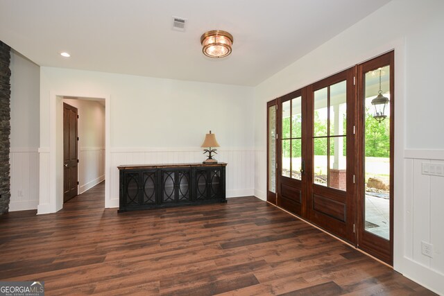 foyer with dark hardwood / wood-style flooring and french doors