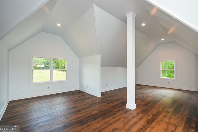 bonus room with dark hardwood / wood-style floors, plenty of natural light, and lofted ceiling