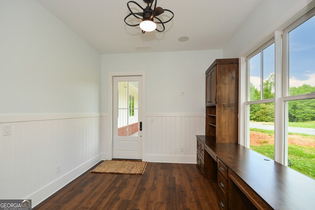 doorway to outside with dark hardwood / wood-style floors and ceiling fan