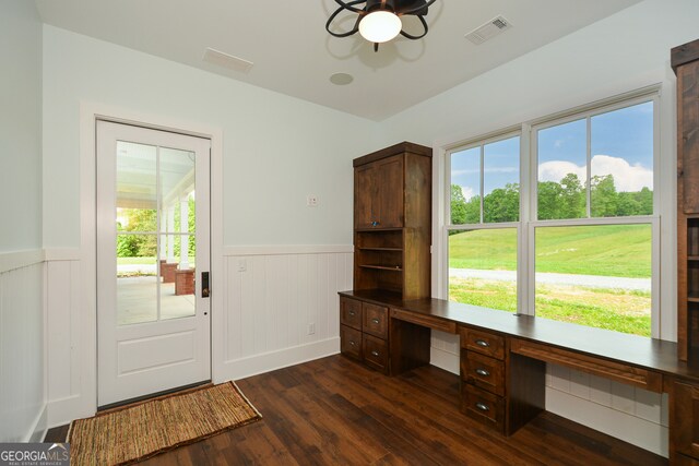 unfurnished office featuring dark hardwood / wood-style flooring