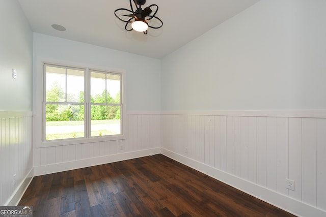 spare room with ceiling fan and hardwood / wood-style flooring