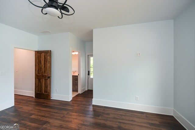 spare room with dark hardwood / wood-style flooring