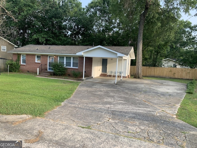 single story home with a front lawn and a carport