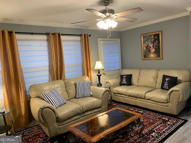 living room with wood-type flooring, ceiling fan, and crown molding