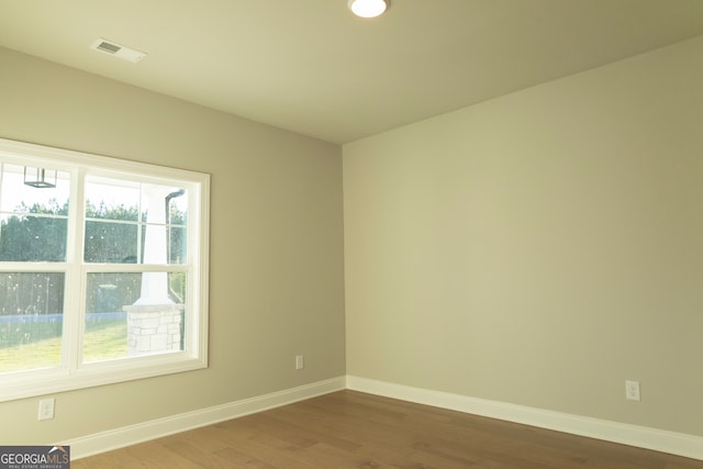 unfurnished room featuring hardwood / wood-style floors