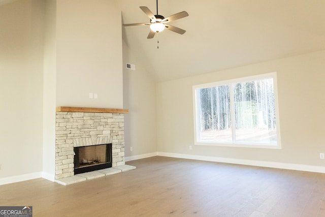 unfurnished living room featuring a fireplace, visible vents, baseboards, a ceiling fan, and light wood-type flooring