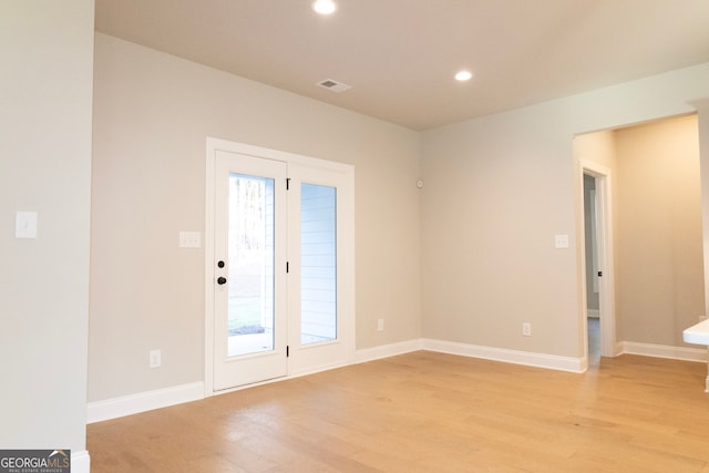 empty room featuring light hardwood / wood-style floors