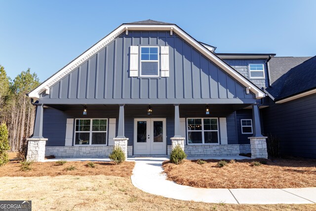 property entrance with french doors and a porch