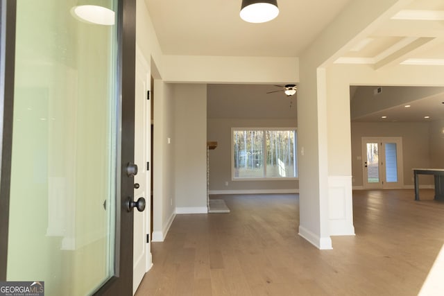 interior space with wood finished floors, visible vents, and baseboards