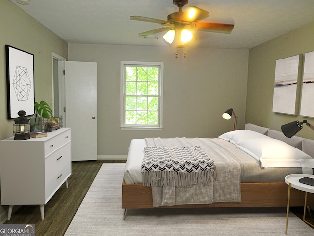 bedroom featuring ceiling fan and dark hardwood / wood-style floors