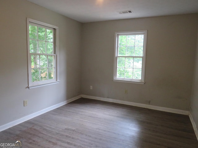 empty room featuring dark hardwood / wood-style floors