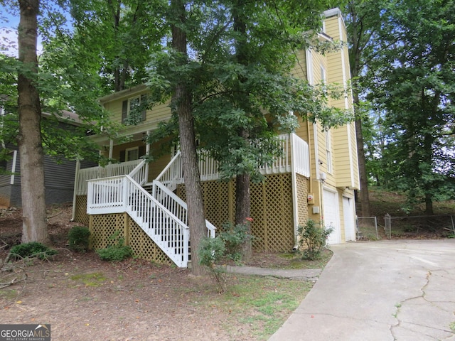 view of front of home featuring a garage and a porch