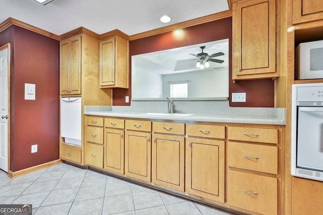 kitchen with ceiling fan, sink, white appliances, and light tile floors