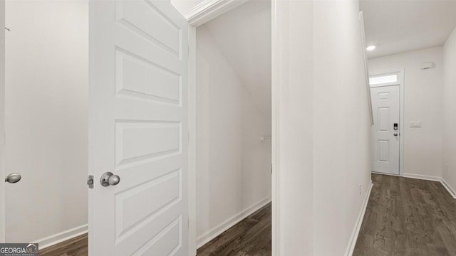 corridor featuring dark hardwood / wood-style floors