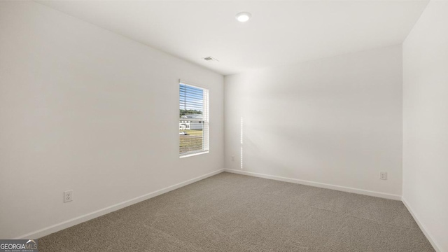 empty room featuring carpet flooring