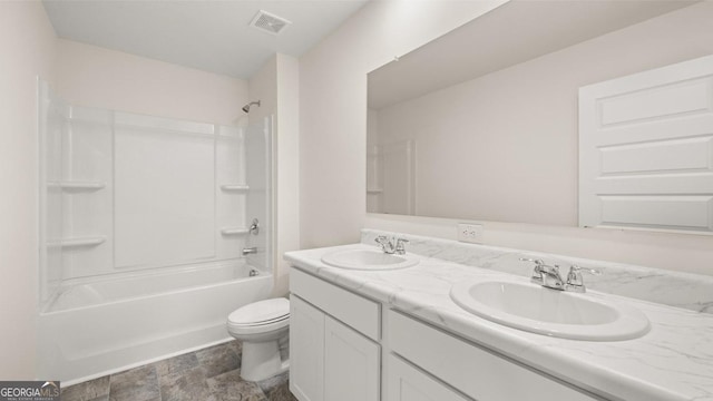 full bathroom featuring bathing tub / shower combination, vanity, and toilet