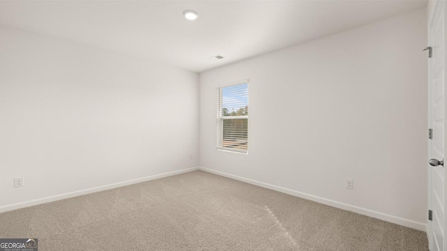 empty room featuring carpet flooring