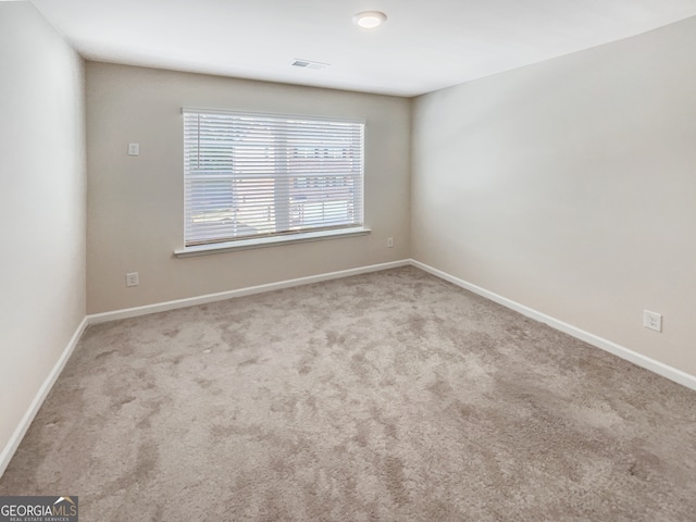 view of carpeted spare room