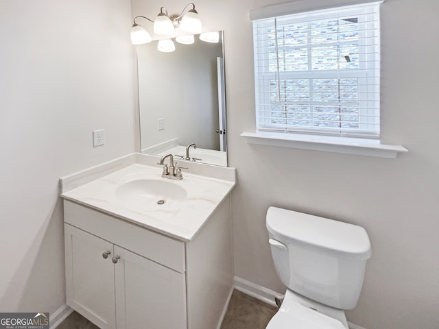 bathroom featuring toilet and large vanity