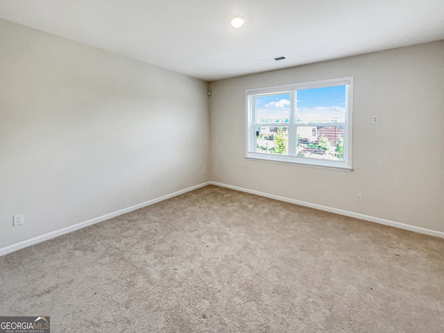 empty room featuring carpet flooring