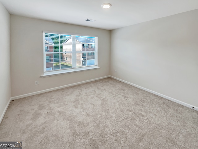 unfurnished room featuring carpet floors