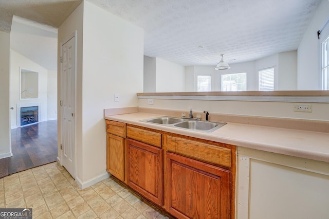 kitchen featuring sink and decorative light fixtures