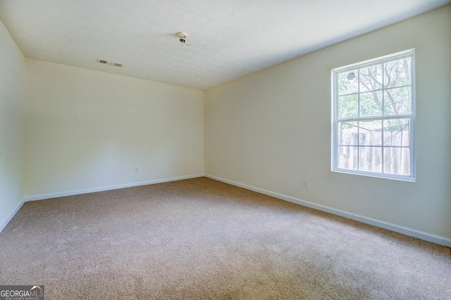 empty room featuring carpet flooring