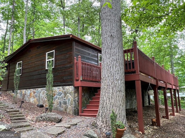 view of side of property featuring a deck