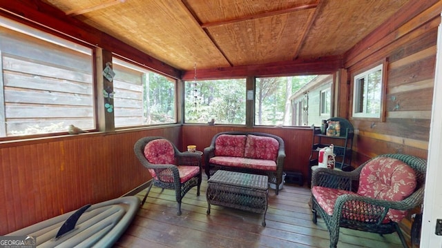 sunroom / solarium featuring wood ceiling