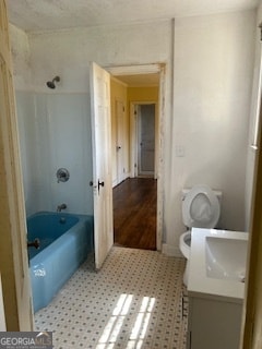 full bathroom featuring bathtub / shower combination, tile flooring, toilet, and vanity