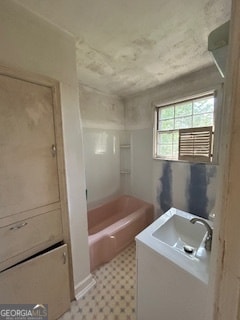 bathroom featuring shower / tub combination, tile floors, and vanity