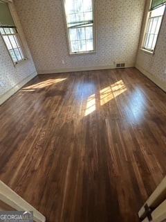 spare room featuring dark hardwood / wood-style floors