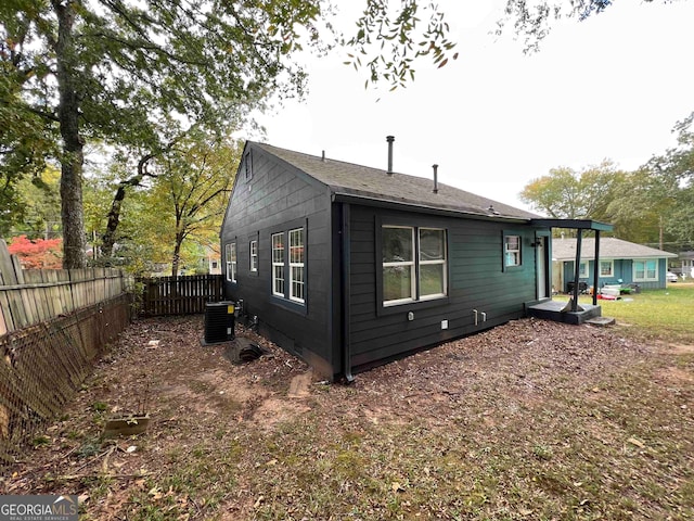 back of property with central air condition unit