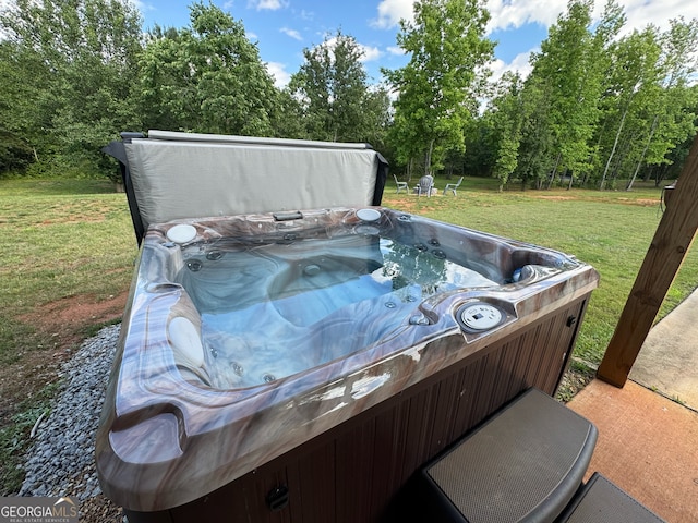 view of patio / terrace with a hot tub