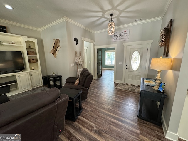 foyer with dark hardwood / wood-style floors and crown molding