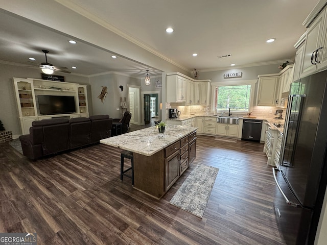 kitchen with ceiling fan, tasteful backsplash, black appliances, dark wood-type flooring, and sink