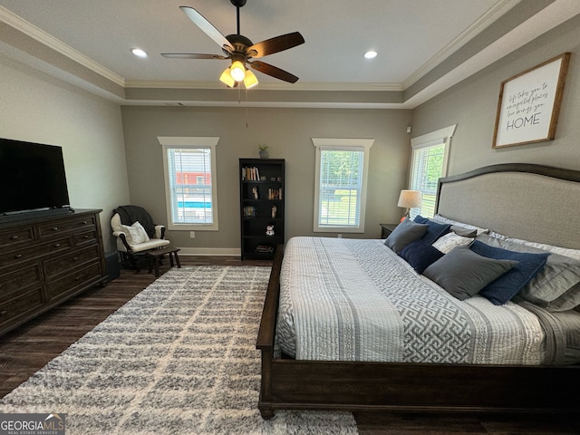 bedroom with dark hardwood / wood-style flooring, ceiling fan, crown molding, and multiple windows