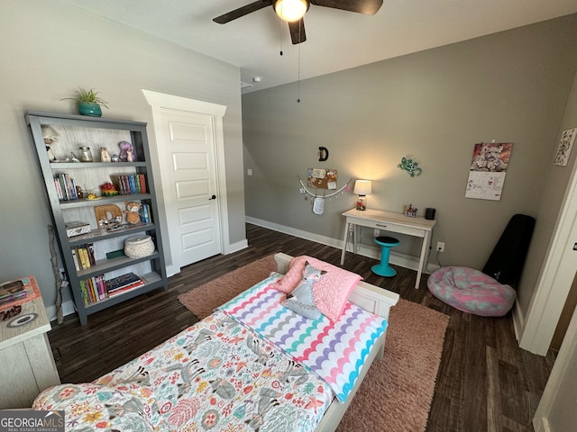 bedroom with ceiling fan and dark hardwood / wood-style flooring