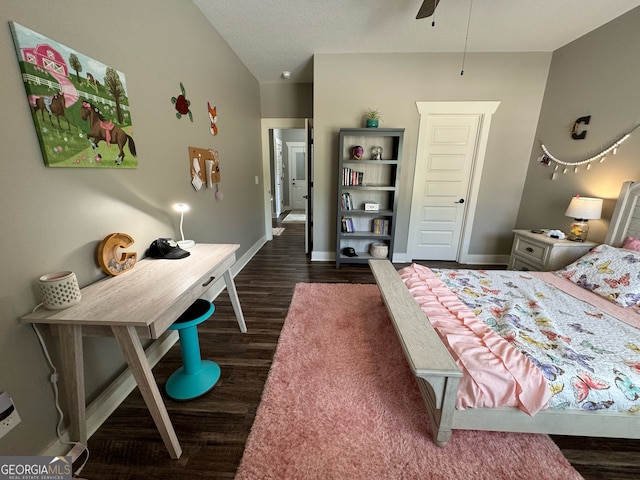 bedroom with dark hardwood / wood-style floors and ceiling fan